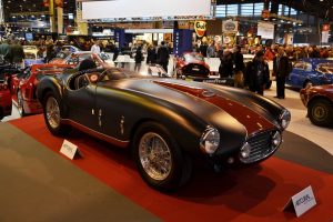 people checking out the inventory when potentially buying a classic car at auction